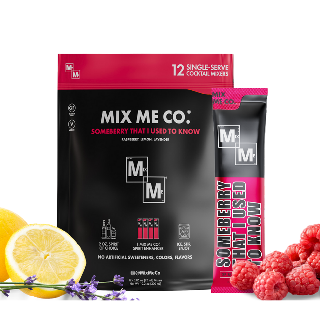 Two packages of Mix Me Co. cocktail mixers with lemons, raspberries, and lavender on a white background